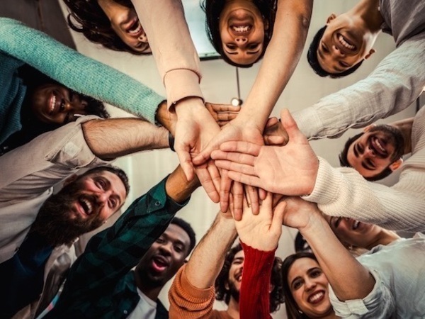 Community stretching hands together